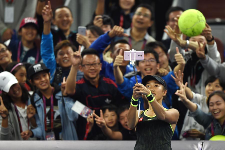 China's Zhang Shuai wins tiebreaker to enter third round