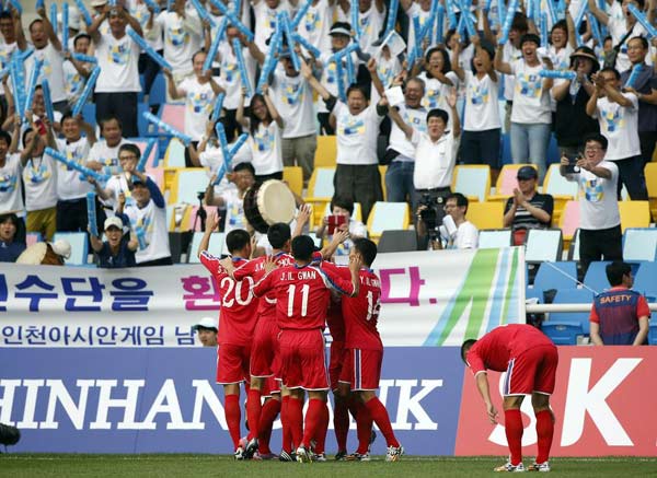 China loses Asian Games soccer opener 3-0