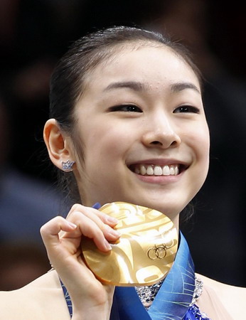 S.Korean Kim wins figure skating gold with record score