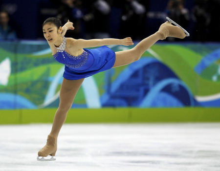 S.Korean Kim wins figure skating gold with record score