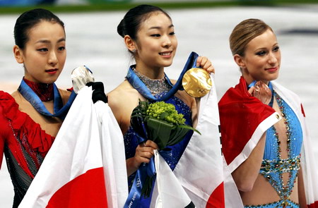 S.Korean Kim wins figure skating gold with record score