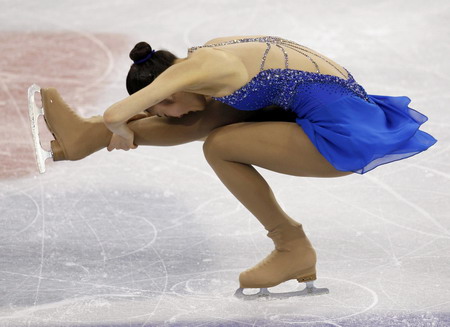 S.Korean Kim wins figure skating gold with record score