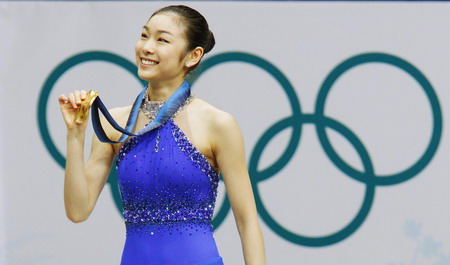 S.Korean Kim wins figure skating gold with record score