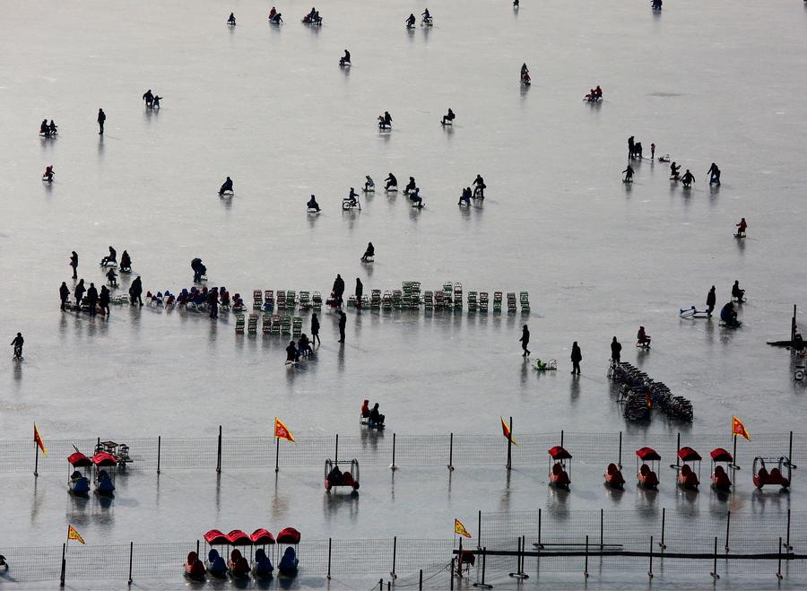 People skate on frozen Kunming Lake of Summer Palace