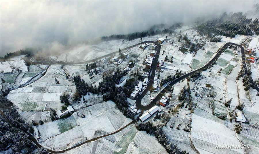 Sea of clouds seen over snow-covered mountains in Hubei