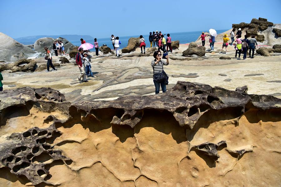 Tourists enjoy scenery of Yehliu Geopark in Taiwan