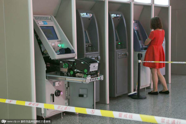 Woman rips ATM open with bare hands