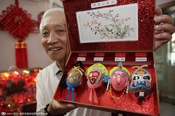 Senior paints intricate masks on eggshells