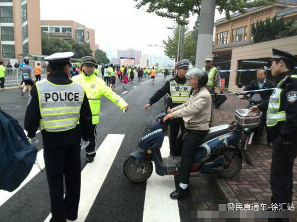 Obedient man breaks into marathon route for wife