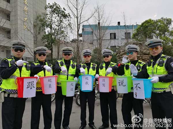Police officers show off 'bucket waists' to promote traffic safety