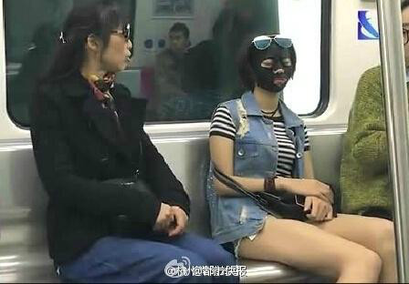 Female rides subway, buses wearing facial mask