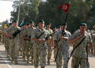 Polish soldiers march during a turn-over ceremony in the Iraqi city of Kut, south of Baghdad December 19, 2005.