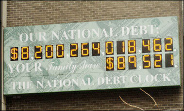 The national debt clock in New York, shows the total US government debt (top) and the calculated amount per family. The clock does not have enough digits to show the debt when it reaches the ten trillion dollar mark, which is expected in the next couple of years.(AFP/