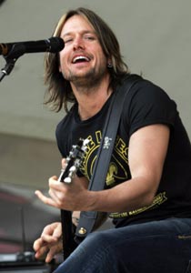 Keith Urban performs at the New Orleans Jazz and Heritage Festival in New Orleans in this May 5, 2006 file photo. Country music star Urban and Oscar-winning actress Nicole Kidman are engaged to be married, People magazine reported May 16, 2006. According to People, Kidman revealed her engagement to Urban while discussing her work for UNIFEM, the United Nations Development Fund for Women.