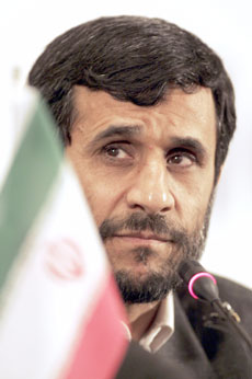 Iranian President Mahmoud Ahmadinejad listens to a question during a news conference at the D-8 summit for the group of developing nations in Nusa Dua on the Indonesian island of Bali May 13, 2006.
