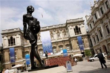 A bronze statue entitled 'The Virgin mother' by artist Damien Hirst is displayed in the courtyard of the Royal Academy of Arts in central London as part of its 238th Summer Exhibition June 7, 2006. (