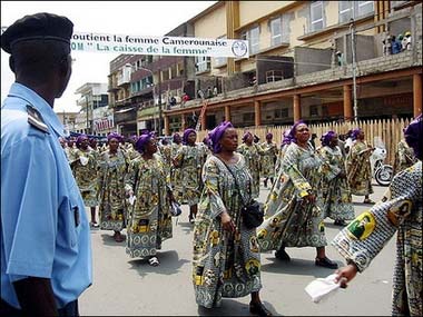 Cameroonian women demonstrate in Douala, Cameroon, on International Women's Day in 2002. Geraldine Sirri was only nine years old when her mother started daily massaging her pre-pubescent breasts with a blazing hot stone to keep them flat -- and keep men's eyes and hands off her daughter. One-quarter of all Cameroonian women are said to have been victims of this painful "breast-ironing," as it is known.(AFP