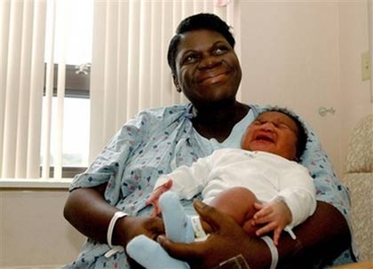 Marie Michel holds her newborn baby Stephon Hendrix Louis-Jean at Backus Hospital in Norwich, Conn., Wednesday, Sept. 13, 2006. Stephon was born weighing 14 pounds 13 ounces. [AP Photo]