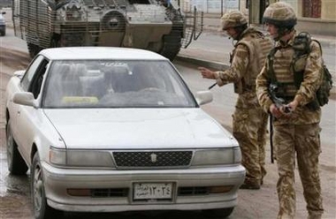 British soldiers stop a motorist at a checkpoint in Basra, 550km (340 miles) south of Baghdad November 4, 2006. 