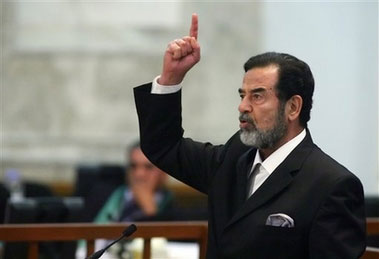 Former Iraqi president Saddam Hussein reacts as the verdict is delivered during his trial held under tight security in Baghdad's heavily fortified Green Zone, Sunday Nov. 5, 2006. Iraq's High Tribunal on Sunday found Saddam Hussein guilty of crimes against humanity and sentence him to die by hanging. (AP