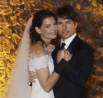 In this photo released by Rogers and Cowan, actor Tom Cruise and actress Katie Holmes pose in their wedding attire on Saturday, Nov. 18, 2006, at the 15th-century Odescalchi Castle overlooking Lake Bracciano outside of Rome. (AP 