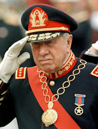 Chilean dictator Augusto Pinochet reviews troops at the Military School in Santiago in this March 10, 1998 file photo. Ex-dictator Pinochet, who ruled Chile from 1973-1990 and spent his old age fighting human rights, fraud and corruption charges, died on Sunday, a week after suffering a heart attack, a military doctor said. 