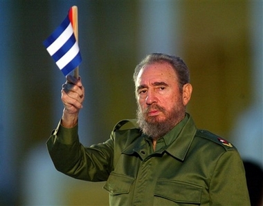 Cuban President Fidel Castro holds a Cuban flag at the beginning of his speech in this Saturday July 26, 2003 file photo in Santiago de Cuba, eastern Cuba. 