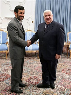 Iranian President Mahmoud Ahmadinejad, left, shakes hands with Syrian Foreign Minister Walid Moallem at the start of their meeing in Tehran, Iran, Tuesday, Jan. 23, 2007. [AP]