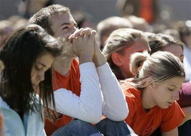 Thousands of students monitor a memorial service at the football stadium on the campus of Virginia Tech University in Blacksburg, Va., Tuesday, April 17, 2007. 