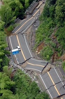 National highway is cut off following a powerful quake in Nagaoka, northwestern Japan, Monday, July 16, 2007. A 6.7-magnitude earthquake rocked Japan's northwest coast on Monday, and media reports said at least five people were killed and more than 500 injured. The area was plagued by a series of aftershocks, the strongest of which was magnitude 5.8. [AP]