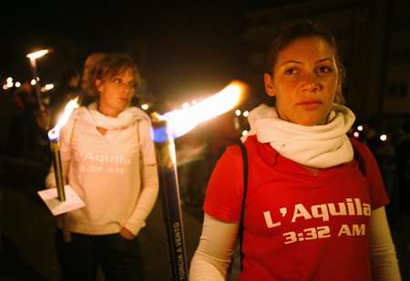 Torch procession commemorates L'Aquila quake