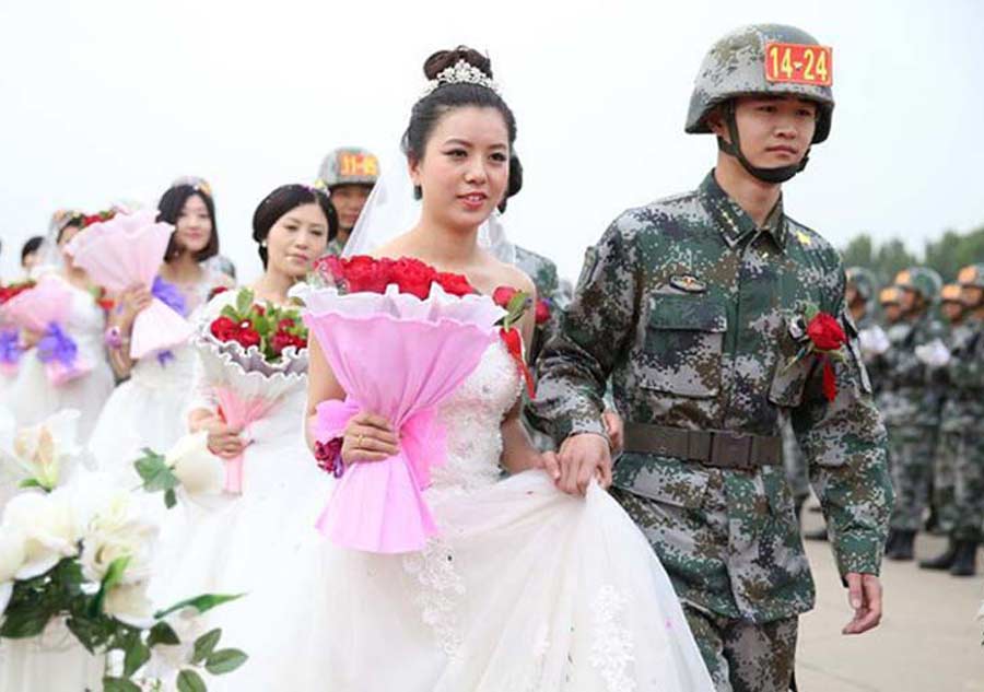 V-Day parade soldiers have group wedding