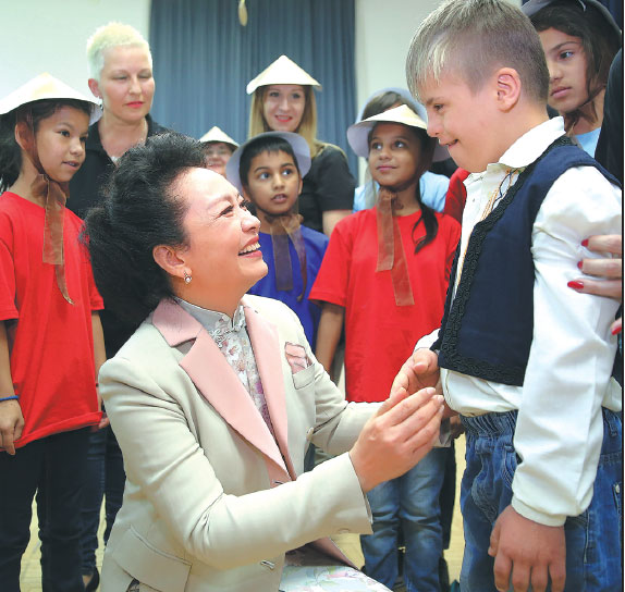 First lady enjoys school show, garden tour