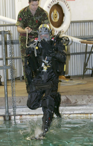 Britain's Prince Harry (front) dives into the water during his visit to the Royal Navy's fleet diving squadron at Horsea Island in Portsmouth, southern England, Oct. 31, 2007. It was Prince Harry's first official visit since becoming Commodore-in-Chief of small ships and diving.