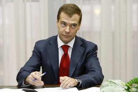 Russia's First Deputy Premier and presidential nominee Dmitry Medvedev signs papers as he submits his documents to be registered as a candidate in March 2008 presidential election at the Central Election Commission in Moscow, Thursday, Dec. 20, 2007.