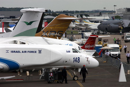 Rain matches gloom at Paris Air Show