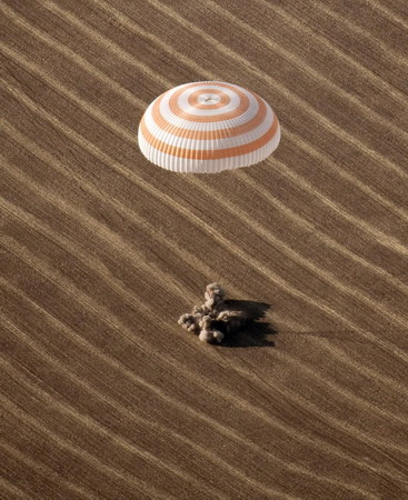 Russian spacecraft with circus tycoon lands safely