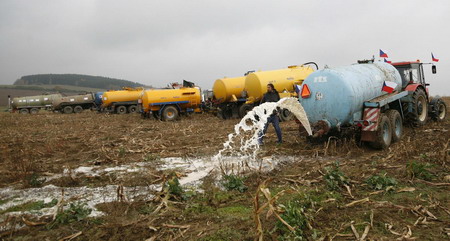 Czech farmers dump milk to protest price slump