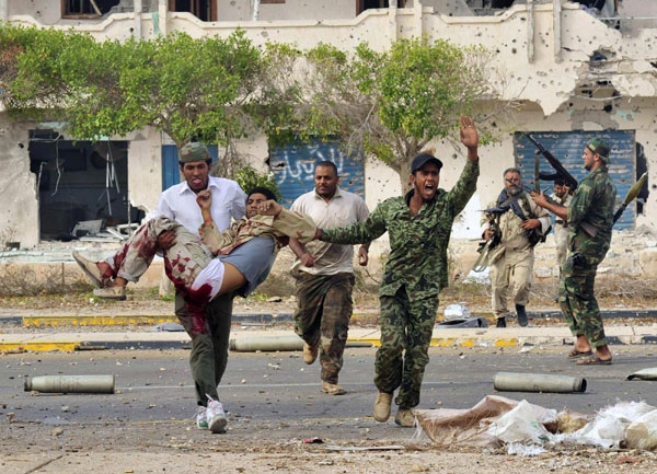 Gadhafi killed as Libya's revolt claims hometown