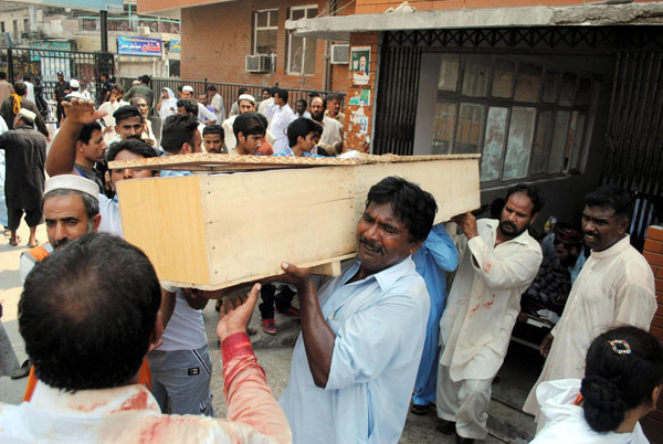 Twin suicide blasts kill 56 in Pakistan