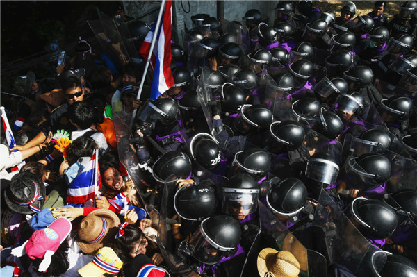 Protesters swarm in Bangkok to demand PM resign