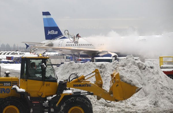 Over 400 flights canceled in NY snow