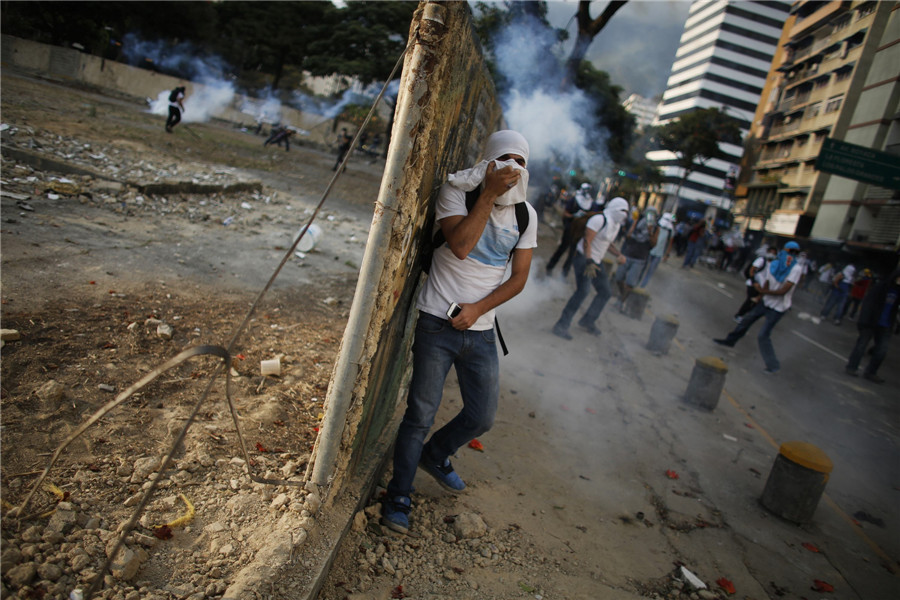 Protesters take part in clashes in Venezuela