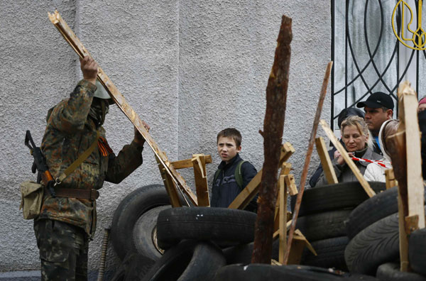 Armed men seize two government buildings in eastern Ukraine