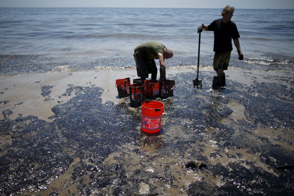 Crews work to clean California beach fouled by oil pipeline spill