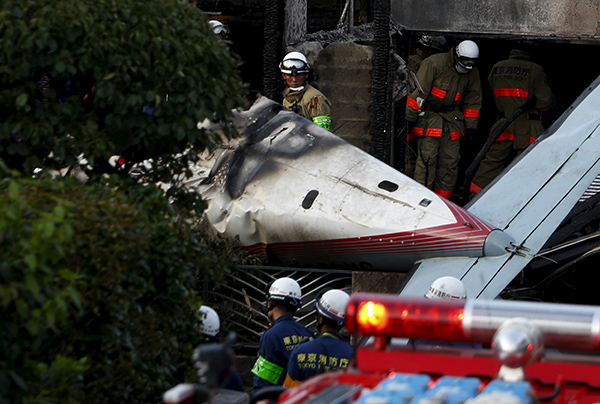 Small plane crashes in Tokyo neighborhood; 3 dead, 3 survive