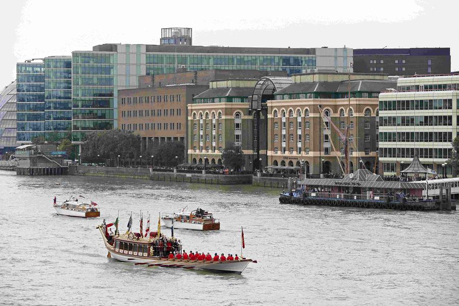 Flotilla sails down Thames to mark Queen's long reign