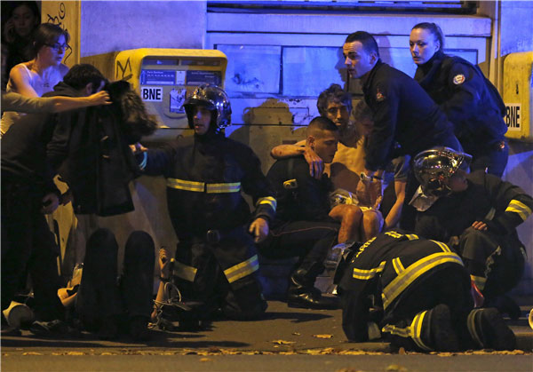 Over 100 dead in Paris shootings, hostages held: French media