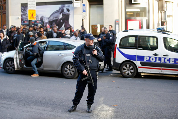 Man shot dead outside Paris police station, too early to call terror act