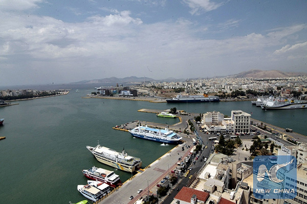 Greece, Chinese shipping giant sign agreement for Piraeus port stake sale